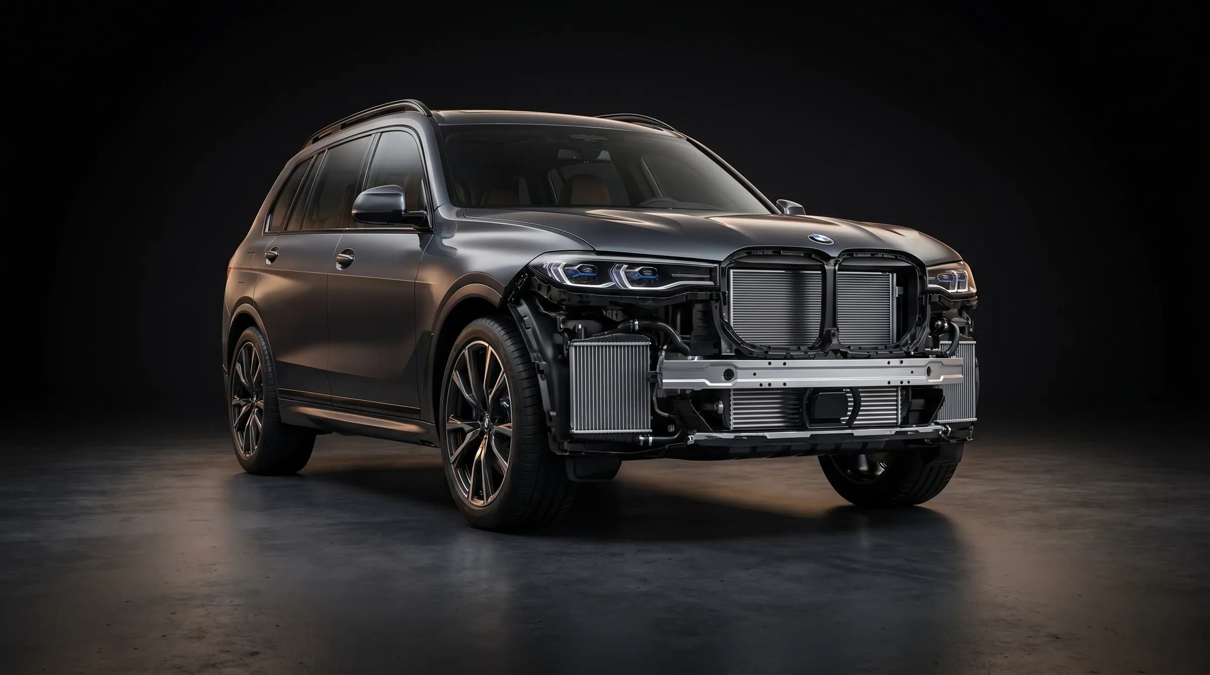 Снятый пакет радиаторов BMW X5 G05 на стенде в студии детейлинга Санкт-Петербурга