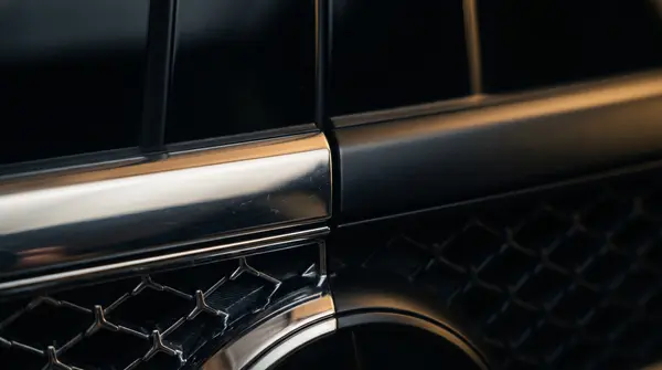 Mercedes E-Class W214 after full anti-chrome: window trim, grille, and handles painted black with 2K paint